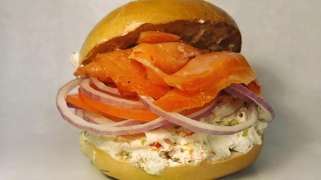 Sliced Nova Lox with Cream Cheese on a Bagel.